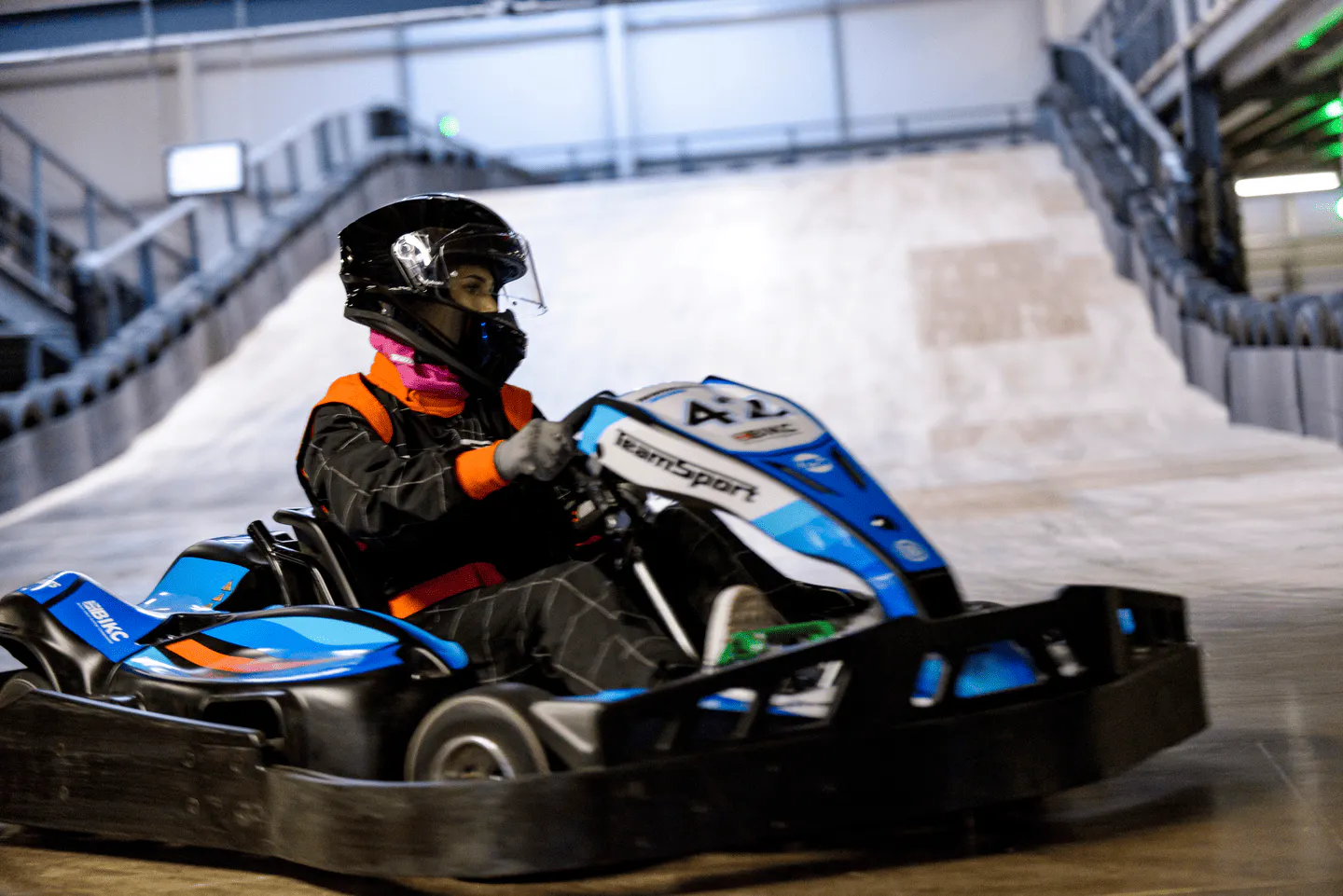 Racers enjoying indoor go-karting at TeamSport
