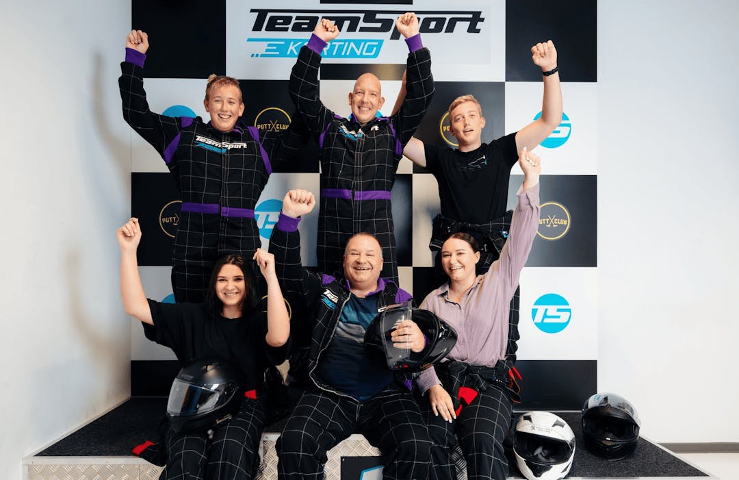 Go Karting Party Celebrating on the Podium