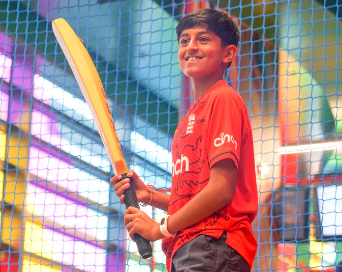 Boy Playing Sixes Social Cricket