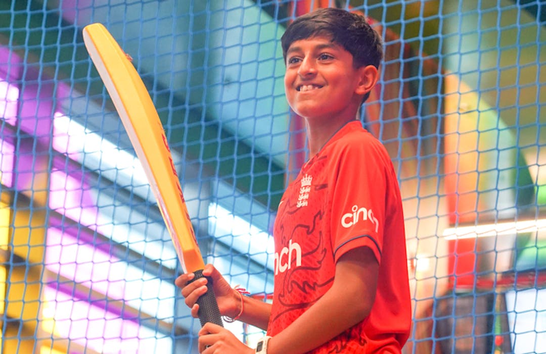 Boy playing virtual cricket at TeamSport Bournemouth