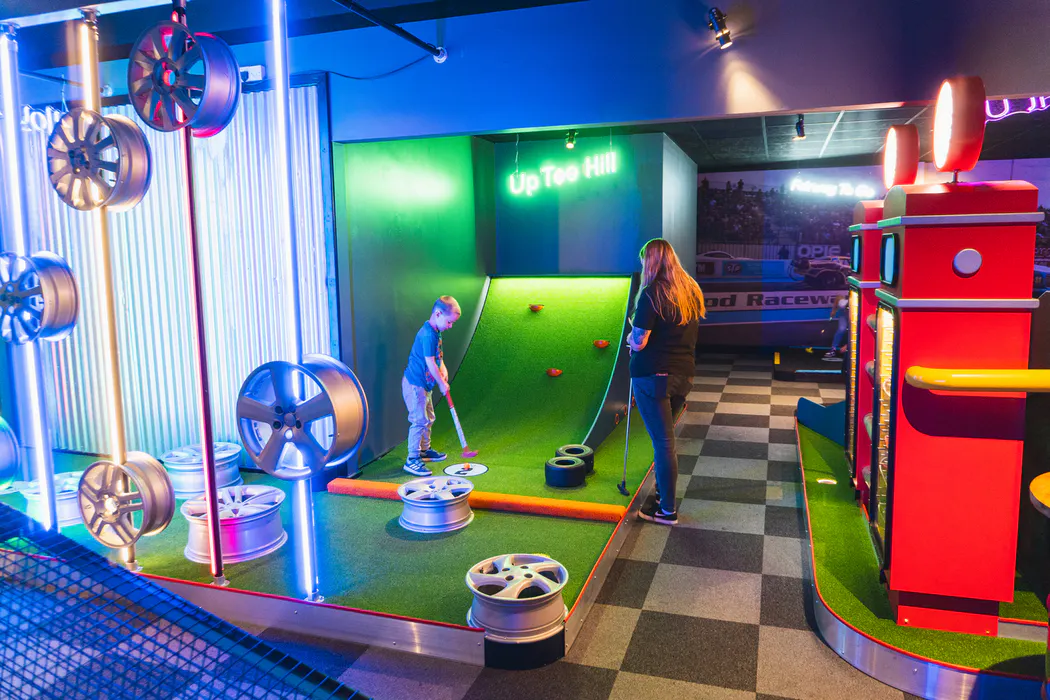 Putt Club Farnborough racing‑style crazy golf hole with interactive course features