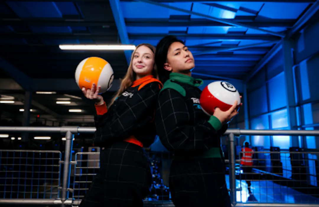 People Posed With Ten-Pin Bowling Balls
