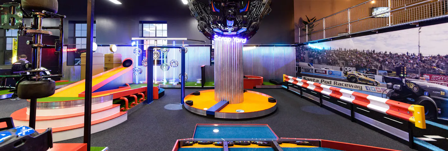 Motorsport‑themed crazy golf venue interior