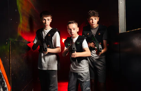 Players navigating an indoor laser tag battleground