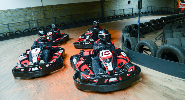 Four Petrol go karts cornering at Edmonton