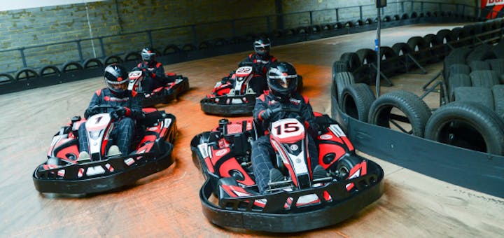 Four Petrol go karts cornering at Edmonton