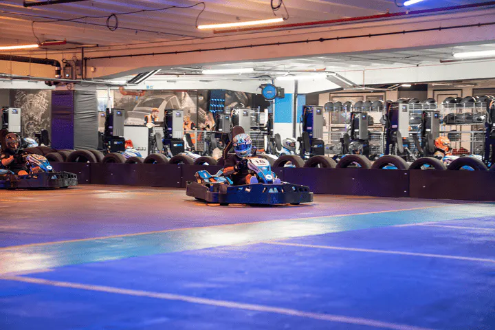 Go karts competitively racing
