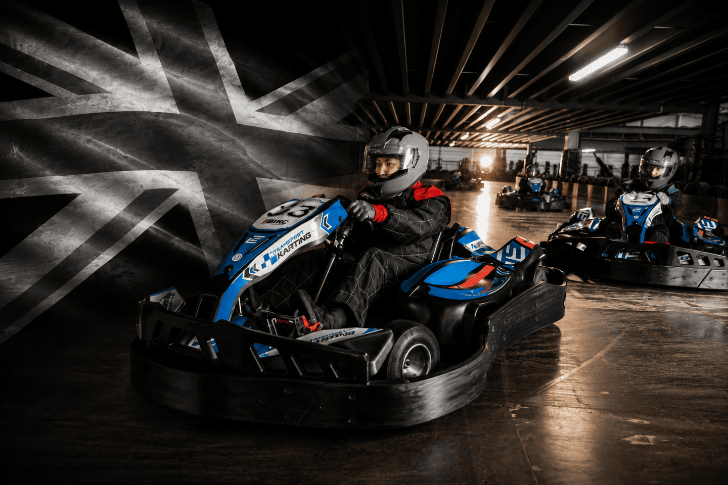 TeamSport indoor go-karting with a black and white Union Jack flag