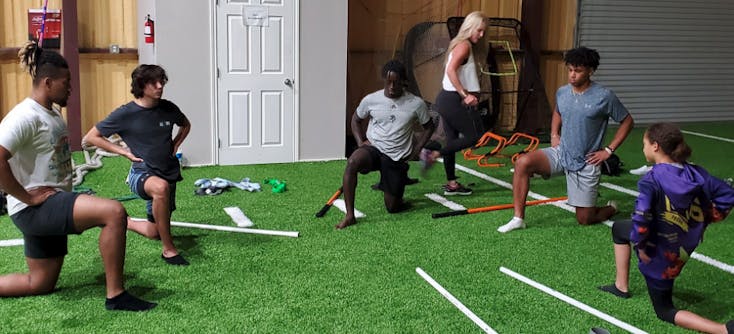 athletes stretching during a small group personal training session