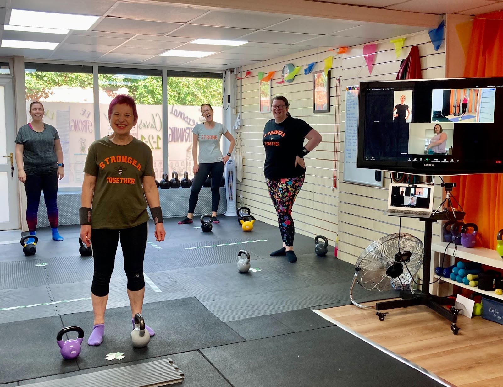 Members enjoying a hybrid class in Maggie's studio