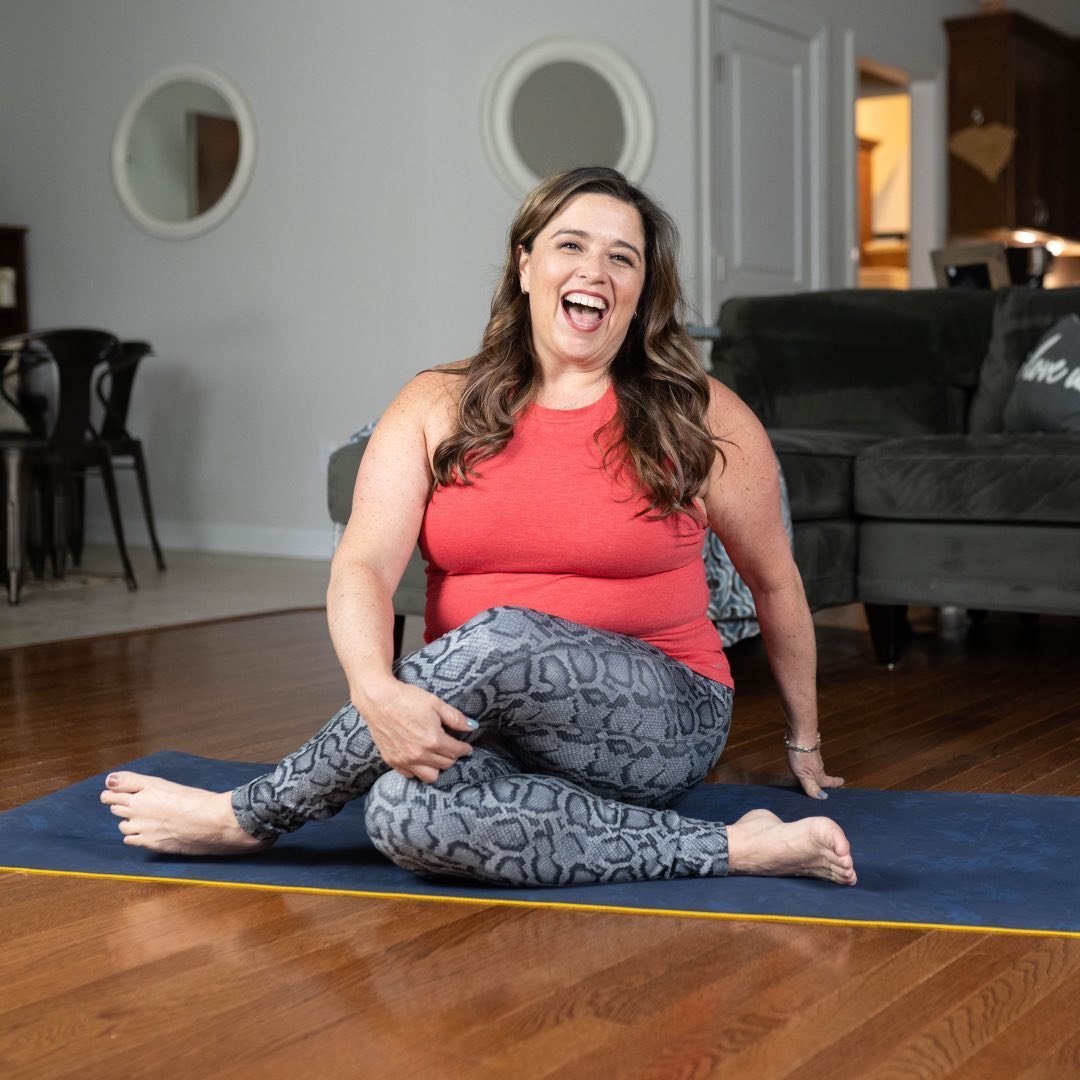 Kelly practicing yoga at home