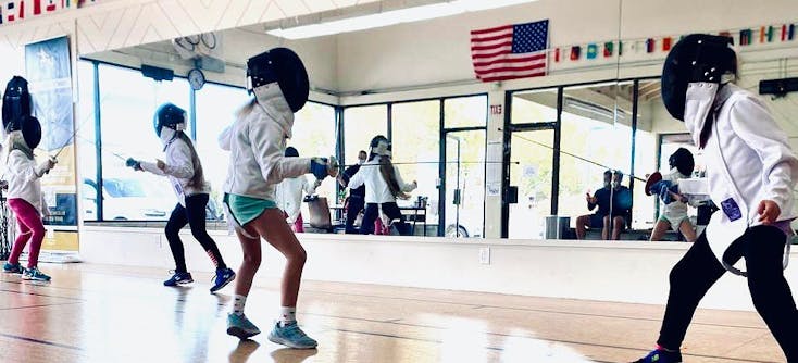 A fencing class in Olga's fencing studio
