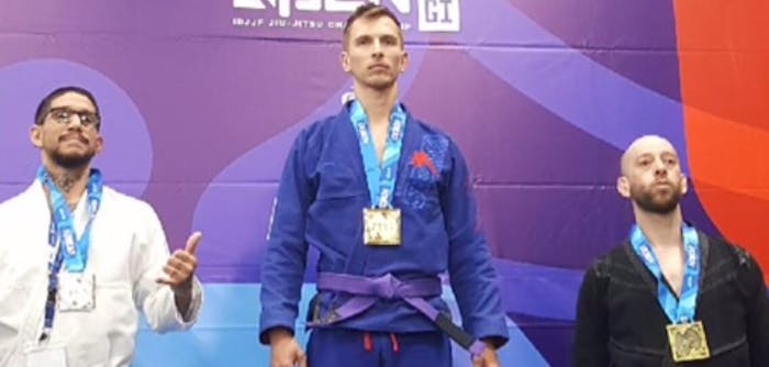 Tom winning first place in a Brazilian Jiu-Jitsu competition