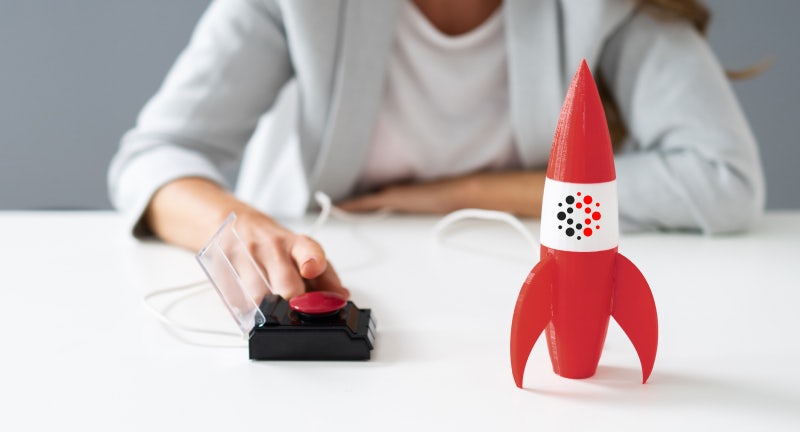 A woman ready to press the rocket launch button.