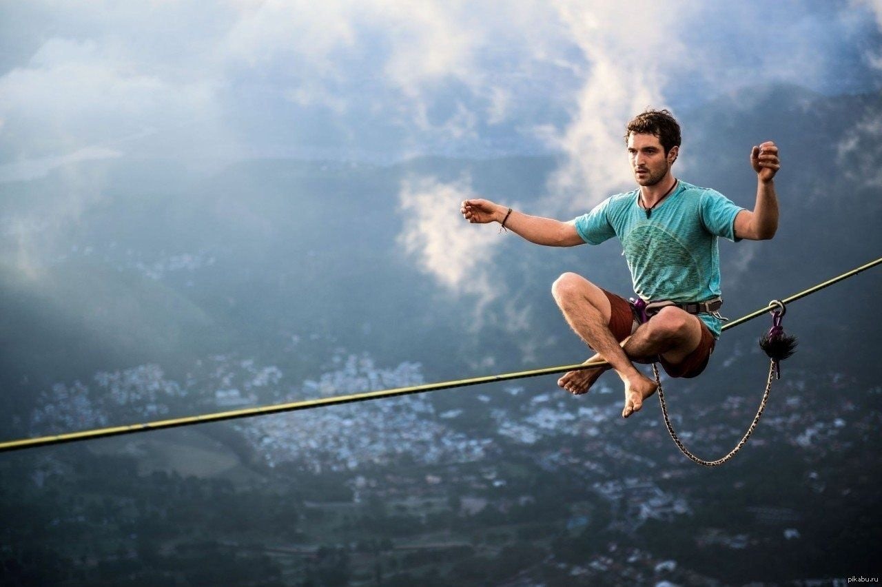 A person practicing Slack lining.