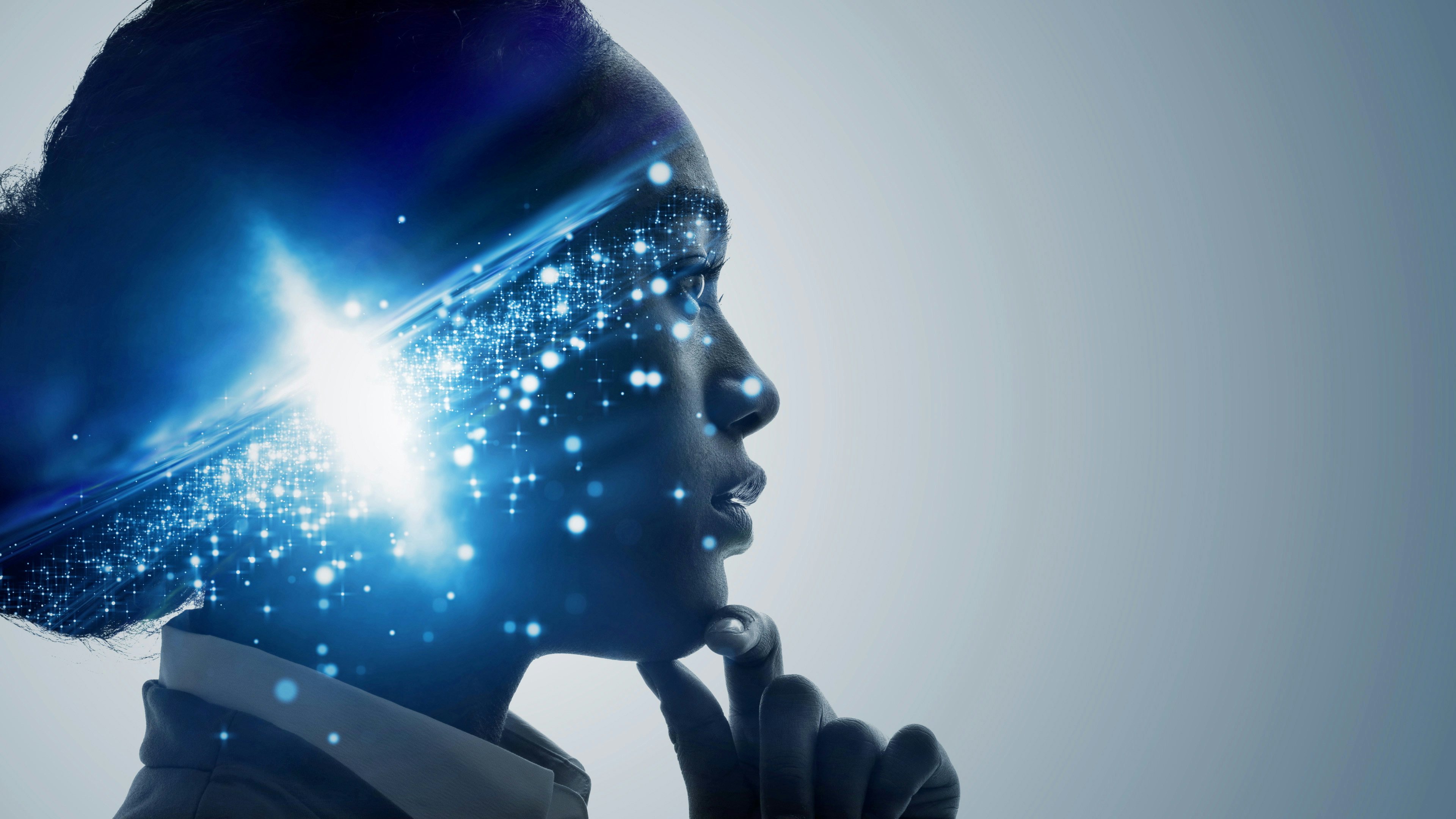 Woman thinking and a sparkle of light inside her head.