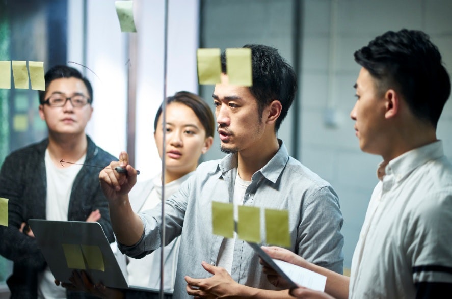 A group of people brainstorming.