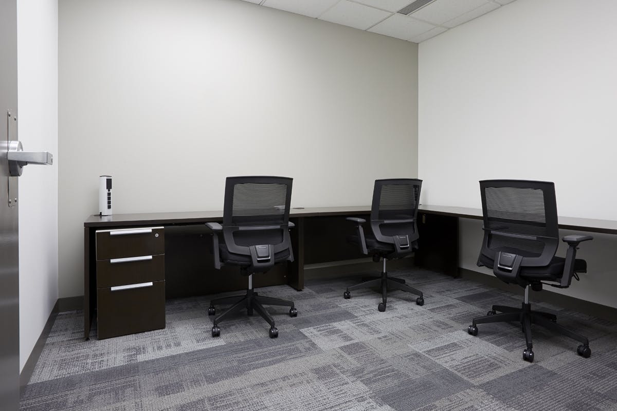 Private office with office tables and chairs.