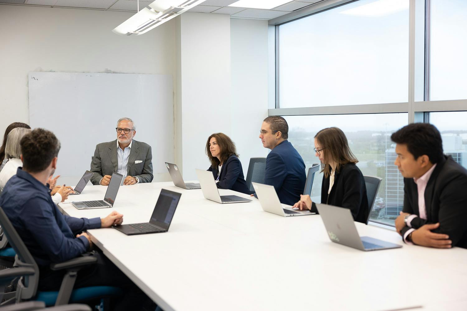 Group discussion in the boardroom with the view from the boardroom in the background