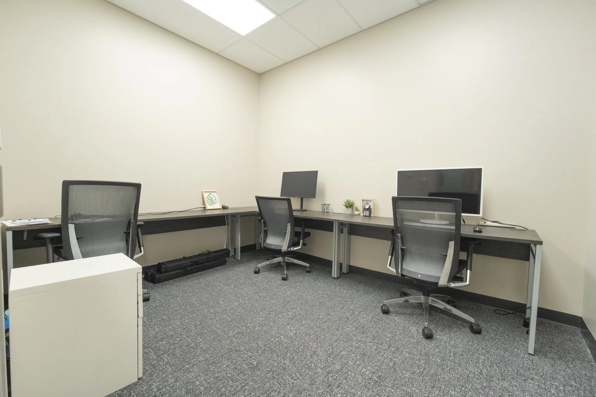 Private office with desk and chairs