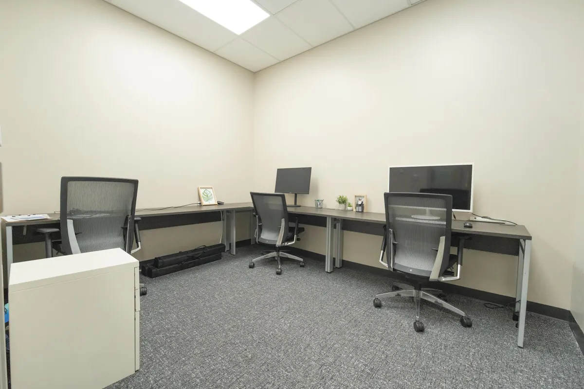 Private office with desk and chairs