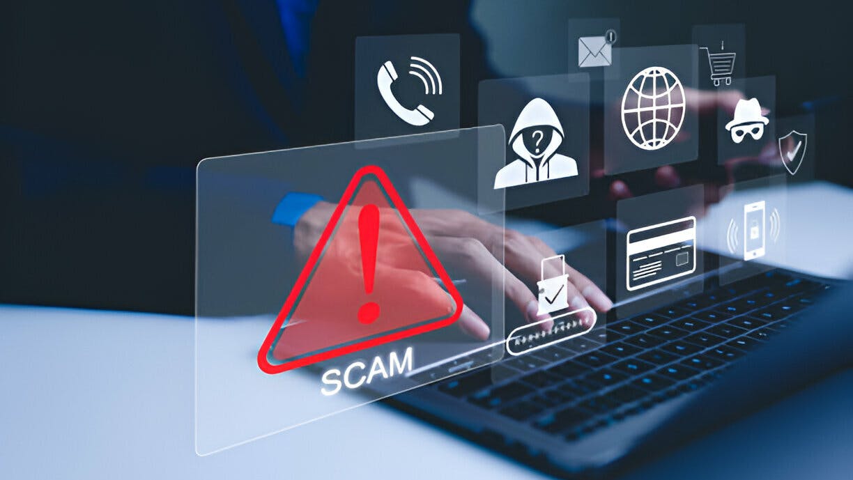 Scam Alert Warning with Cybersecurity Icons. A person using laptop, warning sign for scams with icons representing online threats, phishing, and cybersecurity. Unknown person, suspicious scammer, stock photo
