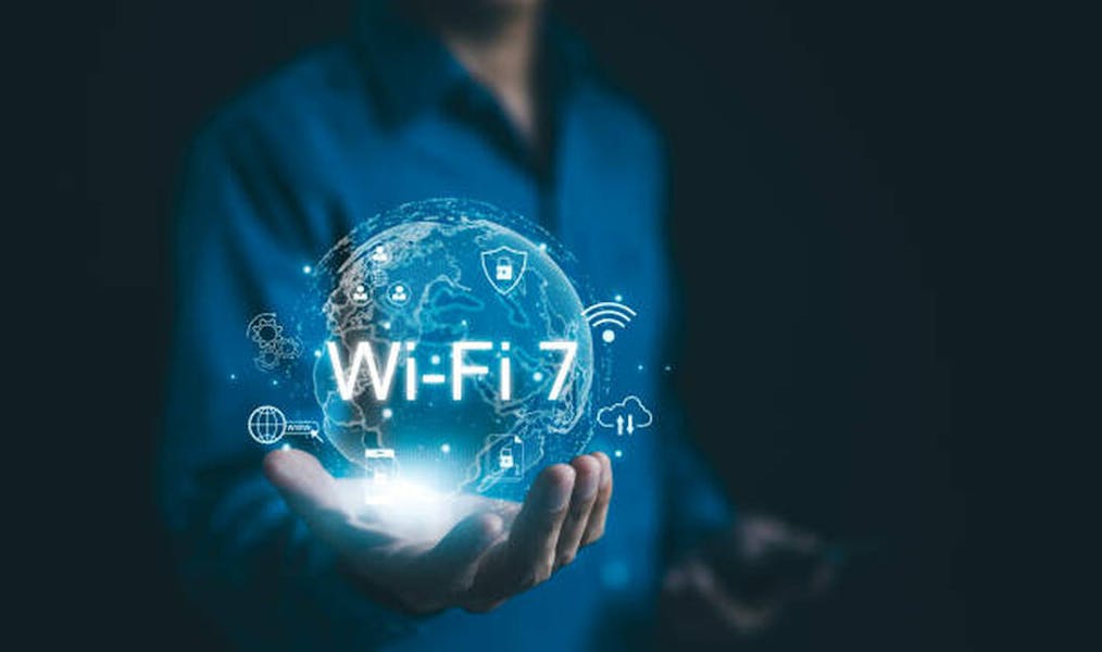 Global Wi-Fi Connectivity and Internet Technology Concept. A person holding a holographic globe highlighting Wi-Fi 7 connectivity, representing the global reach of modern internet technology. wifi7, stock photo