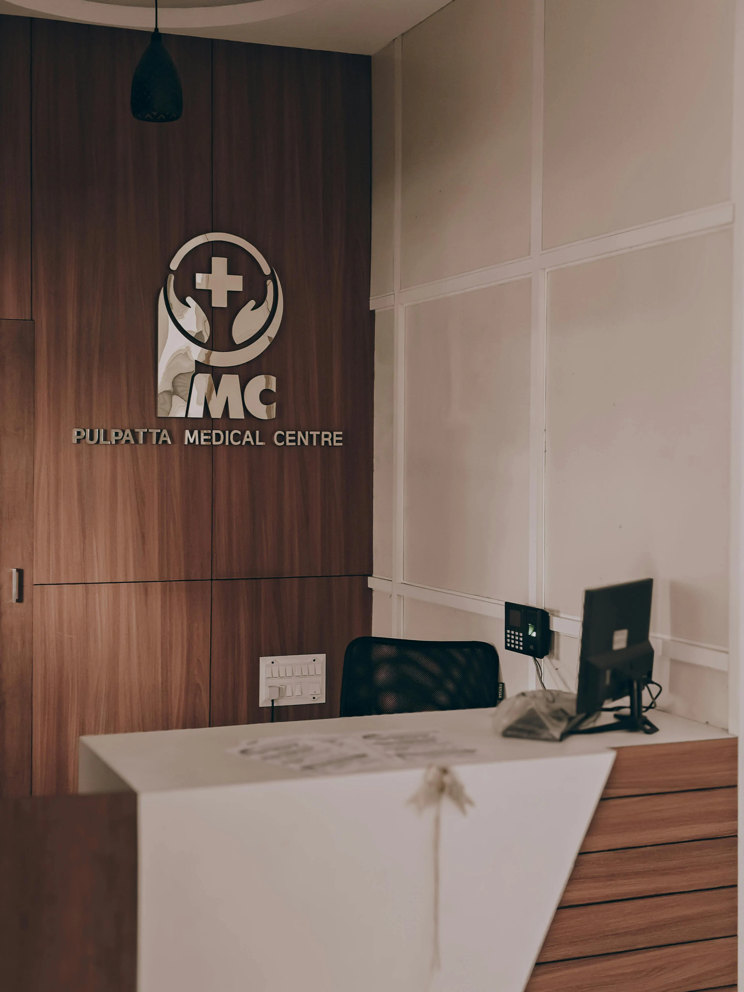 Modern aesthetic clinic reception area with warm wood panelling and a clean contemporary front desk