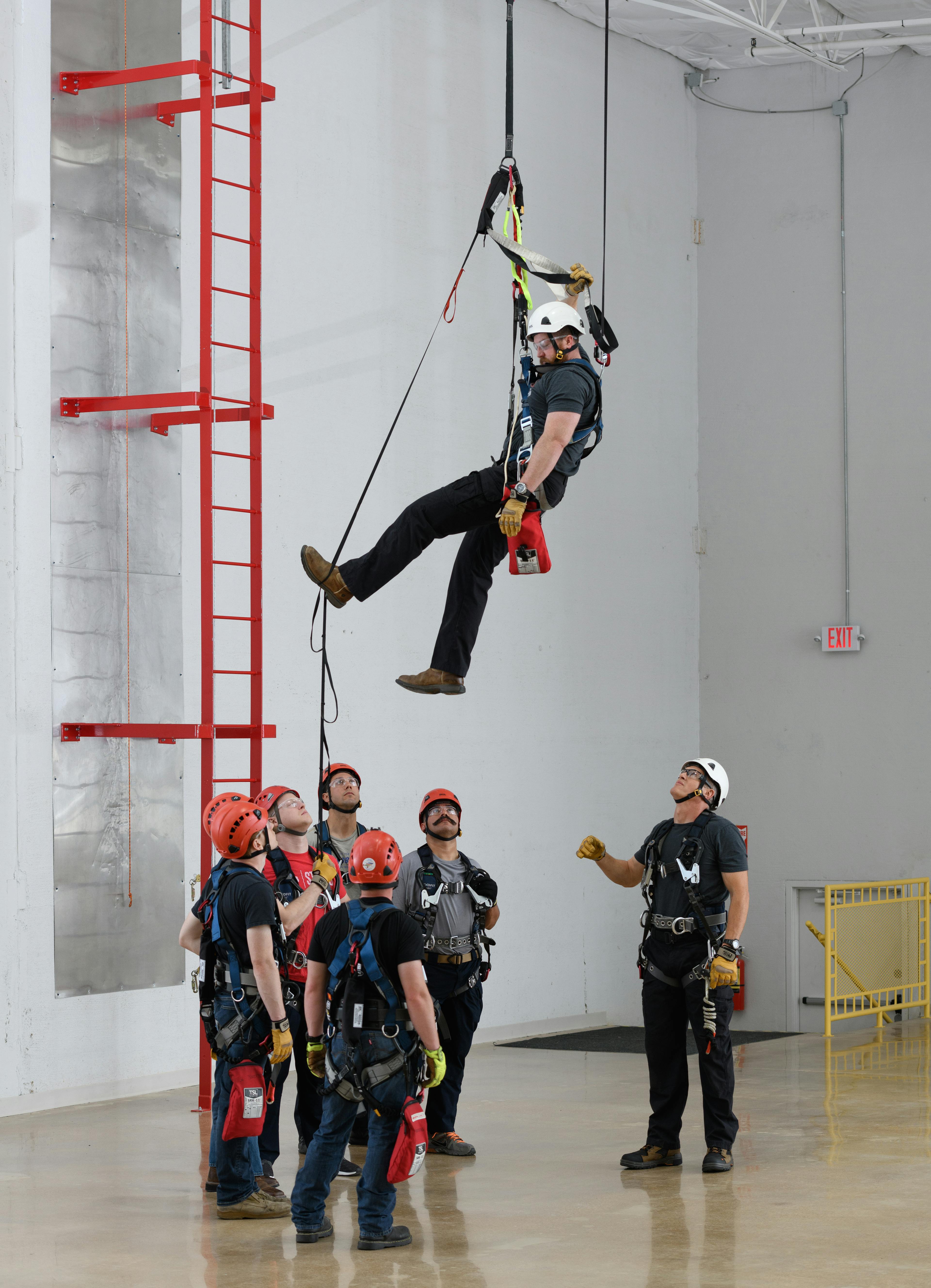 Men doing evacuation and self rescue training at a Tech Safety Lines facility