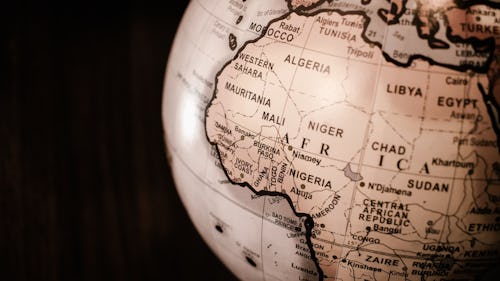 Map of Africa on a globe - Top 10 highest currencies in Africa