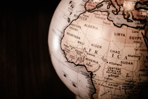 Map of Africa on a globe - Top 10 highest currencies in Africa