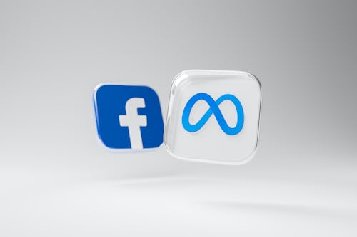 How to buy shares on Facebook: Facebook and Meta logo levitating