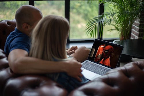 A couple watching a movie together.