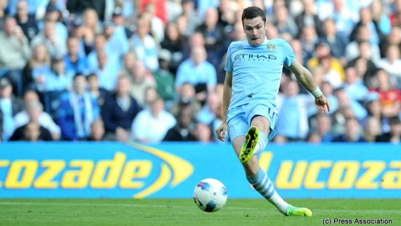 Manchester City's Adam Johnson scores his sides second goal during the Barclays Premier League match at the Etihad Stadium, Manchester.