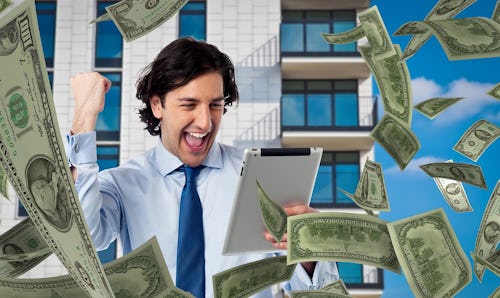 Image of a man wearing a suit and a tear holding an ipad with dollar notes flying around him