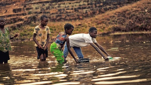 Children fetching water from a river
