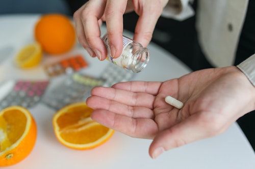 A woman taking zinc supplement