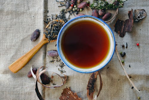 A image of leaves and herbs used for preparing traditional medicine and drinks