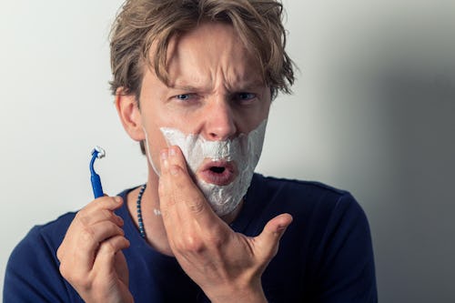 Man shaving with a blunt blade