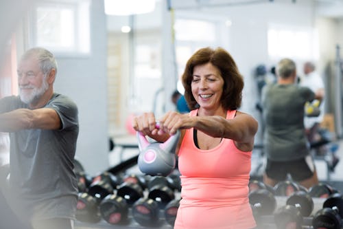 An elderly woman in menopause working out