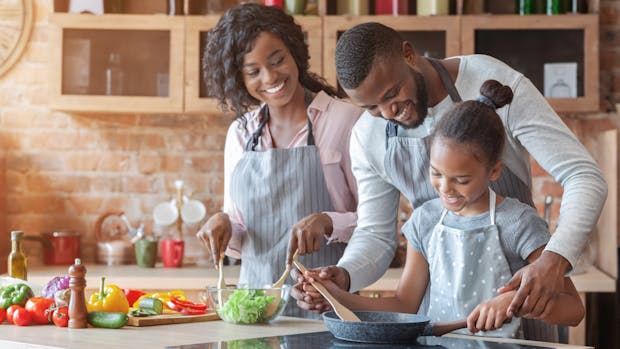 Healthy black family preparing meal with alligator pepper