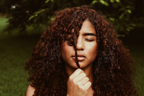 A girl with long, curly hair