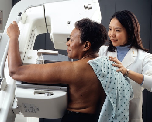 A woman screened to check for a malignant tumour (cancer)