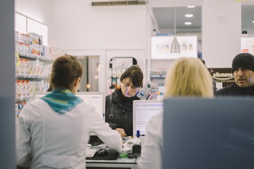 Pharmacists dispensing medicine to patients