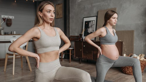 A pregnant woman doing prenatal yoga