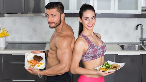Two bodybuilders eating superfoods for building the muscles