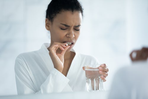 A woman taking morning-after emergency contraceptive pill