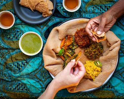 Image showing two people eating african food