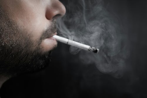 Image of a man smoking a cigarette