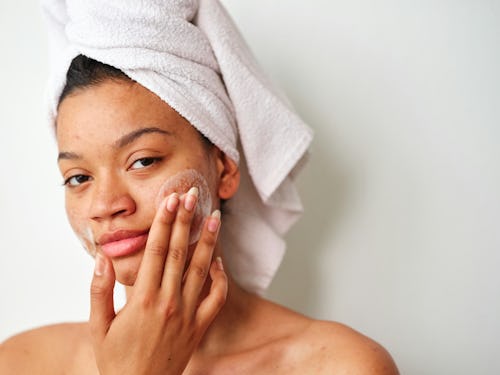 A lady applying a facial cream 